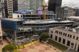 A high-angle view of the strengthening and modernising construction work happening at Wellington's Central Library in Te Ngākau Civic Square.