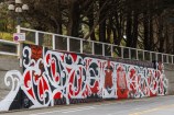 Large mural on Bowen Street, red, black and white in colour.
