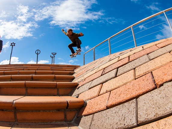 Person skateboarding on a rail.