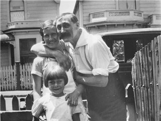 A young girl and her parents in front of their house in Barker Street in 1937.