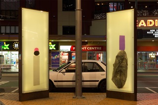 Production Still exhibition installed at Courtenay Place, at night.