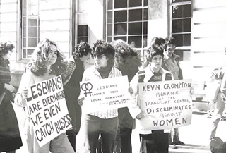 Black and white photograph of pro-lesbian rights protestors holding placards.