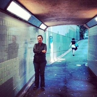 Artist Kedron Parker standing in Woodward Street pedestrian tunnel.