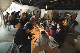 Artists working in a creative space.