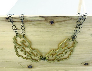 Necklace made of brass and stirling silver by artist Moniek Schrijer.
