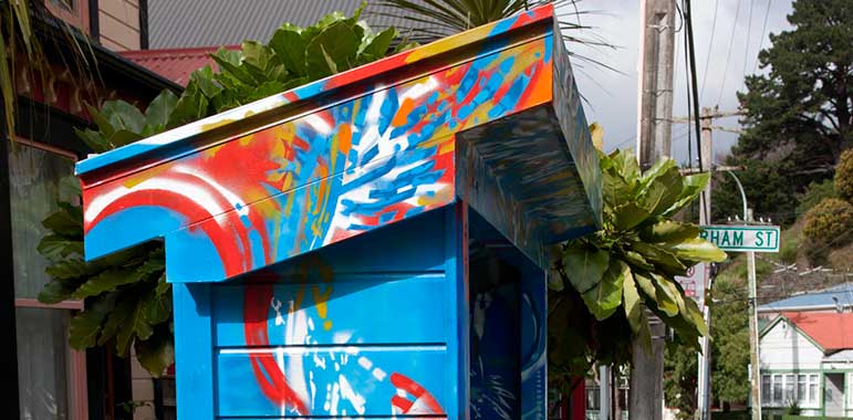 Top side view of bus shelter blue with swirls.