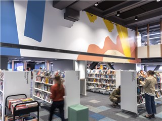 People browsing books at Te Awe Library.