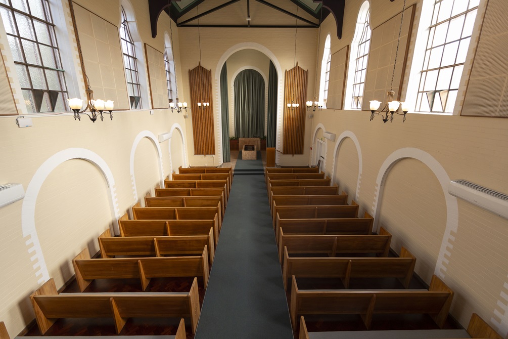 View from mezzanine showing rows of church seats.