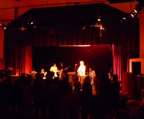 Band performing on the stage at Newtown Hall