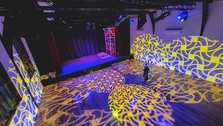 Newtown Community Centre theatre, with lighting projections showing on the floor and walls.