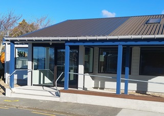 The outside entrance to Linden Community Centre on a sunny day.