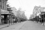 Upper Cuba Street circa 1927 with 126 Cuba Street in the background on the left - a billboard advertising pies is on its side (photograph by Crown Studios).