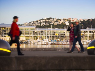 People walking along Wellington's waterfront.