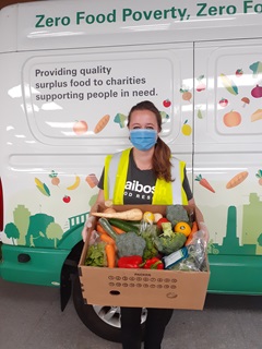 Image of staff packing food in safety gear at Kaibosh food rescue