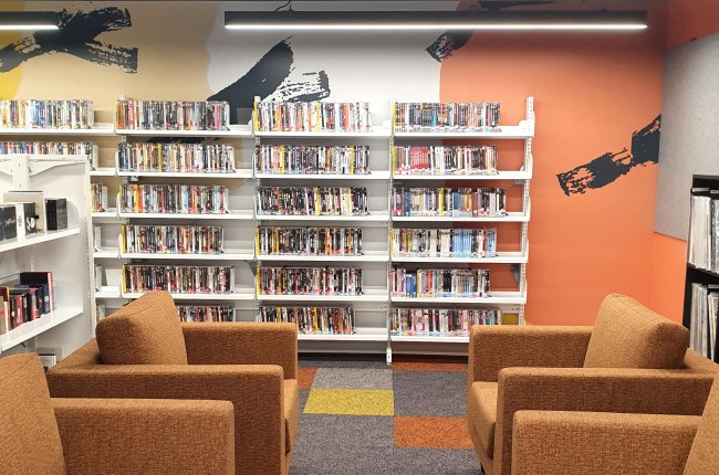 Image of Te Awe library with feature wall and couches