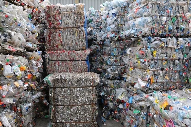 Bales of plastic bottles, thousands of them, ready to be sent to a recycling plant.