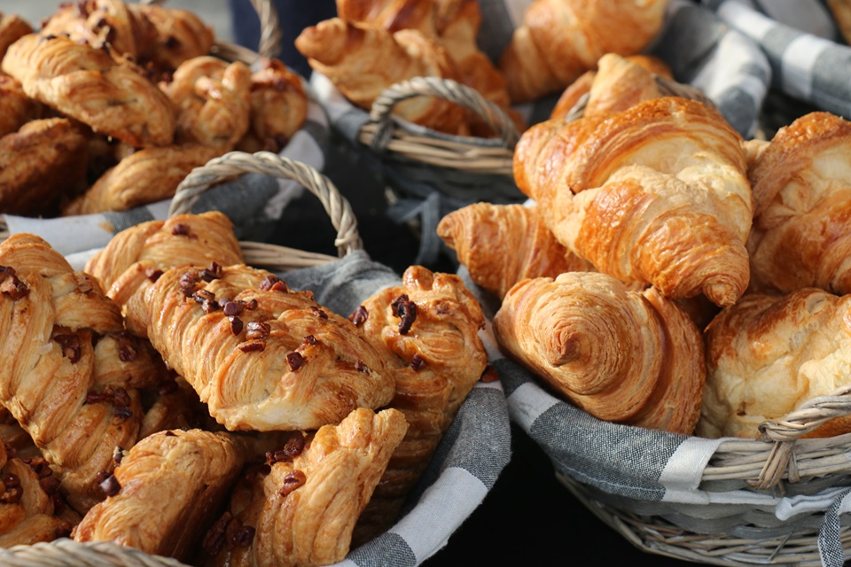 Croissants and pasties made by Wellington-based French chef Lois Sergeant, displayed in baskets.