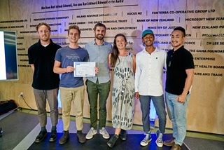 Six people, who developed the Greener Events Metric which was the grand prize winning idea at the Wellington 2021 Climathon challenge, standing in a row presenting their certificate. 