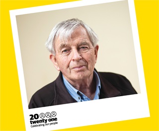 Portrait of Michael Arthurs with the 20 Twenty One series yellow logo.