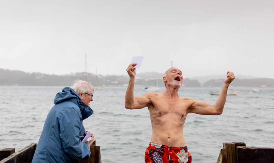 Man getting out of water after winter swim