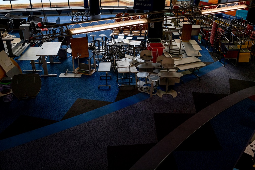 A birdseye view of the ground floor of the Central Library with stacked furniture.