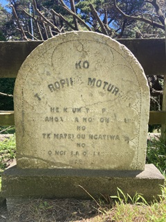 A gravestone in the sunshine.