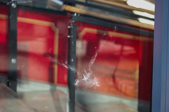 Smudge on window shows impact of bird on Cable Car terminal before decals installed