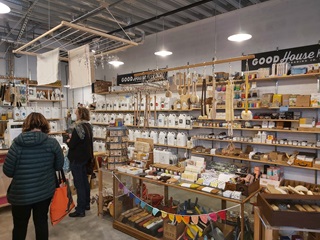 Inside of a store with items on shelves.
