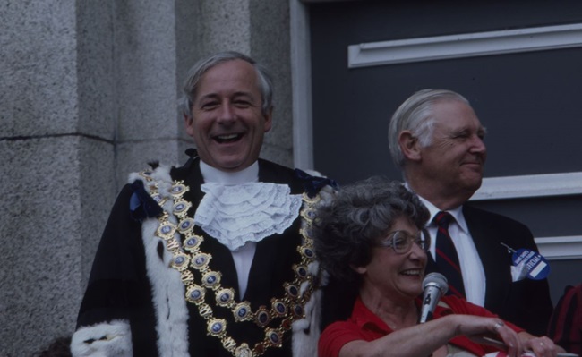 Mayor Michael Fowler watching a parade outside Municipal Office Building circa 1985