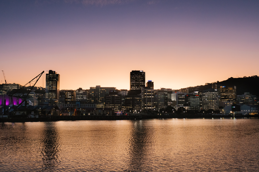 View of the city with the sun setting behind the buildings.
