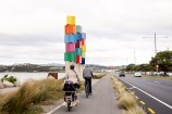 Family cycling down Cobham Drive.