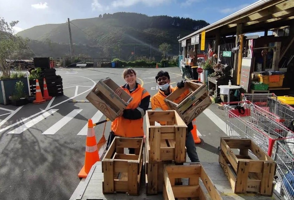 Tip Shop team with some beer crates recovered from the landfill.