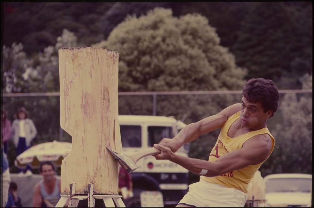 Man chopping wood in competition during Summer City circa 1987