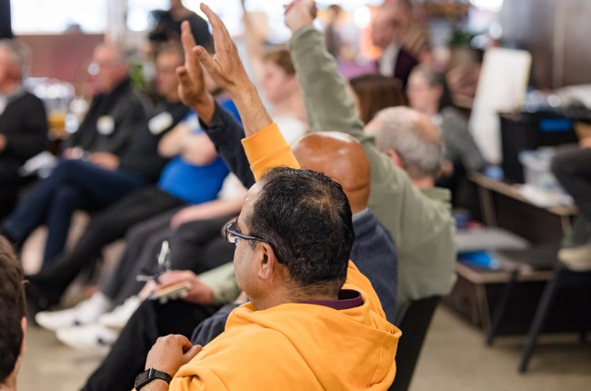 Citizens' Assembly members putting up hands to ask questions