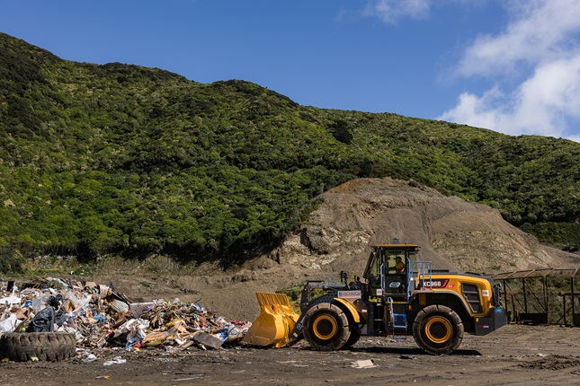 New E truck in action moving rubbish at landfill