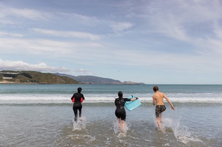 People swimming at Lyall Bay Beach.