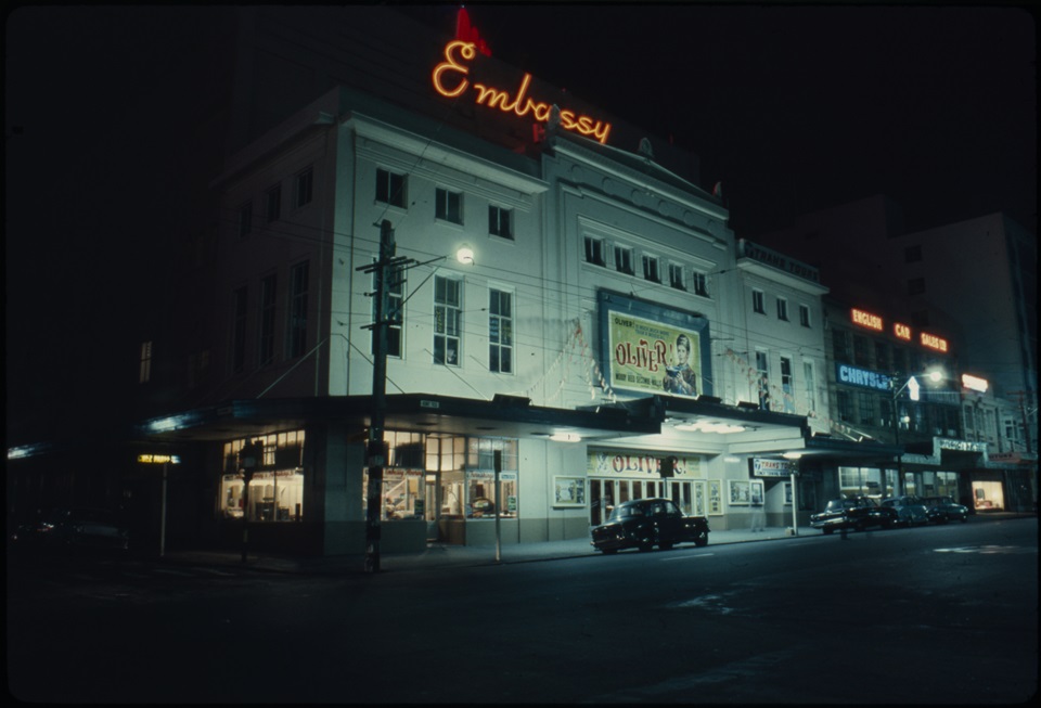 Embassy Theatre at night time advertising film Oliver in 1969