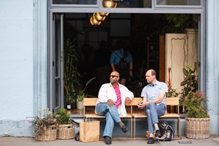 Prak and a WCC employing enjoying the CBD on a sunny bench