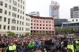 Crowds of people in Civic Square with barricades up.