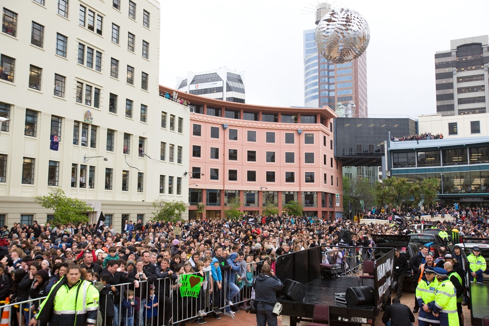 Crowds of people in Civic Square with barricades up.