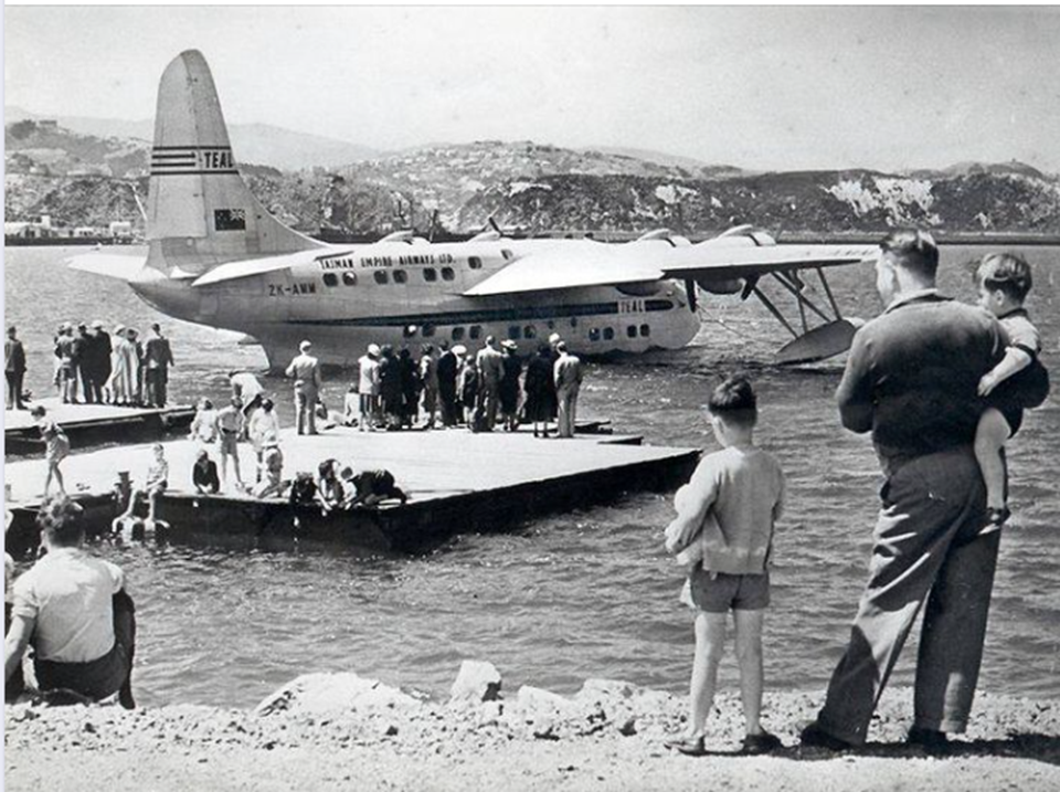 People boarding TEAL plane at flying boat jetty - date range unknown