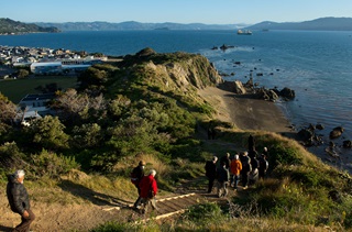 Groups of people walking down Oruaiti reserve.