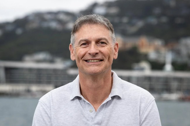 A portrait of Karl Tiefenbacher in front of the Wellington waterfront.