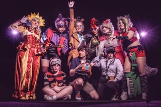 Group of people all dressed up in cosplay.