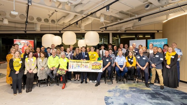 Image of road safety team with a banner reading road safety week