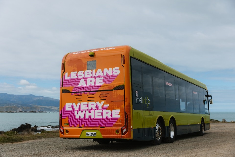 Back of public bus with Lesbians Are Everywhere campaign design.