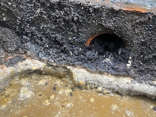 Close up image of a pipe clogged up by a fatberg, which is made up of congealed cooking oils, food waste, and other solids that have been tipped down the pipes instead of disposed of properly. 