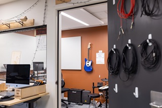 image of the recording space in Waitohi, with an electric blue guitar on the wall