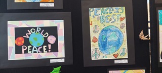 Image of two artworks promoting peace drawn by children at Ngaio school.