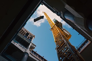 Crane carrying up equipment